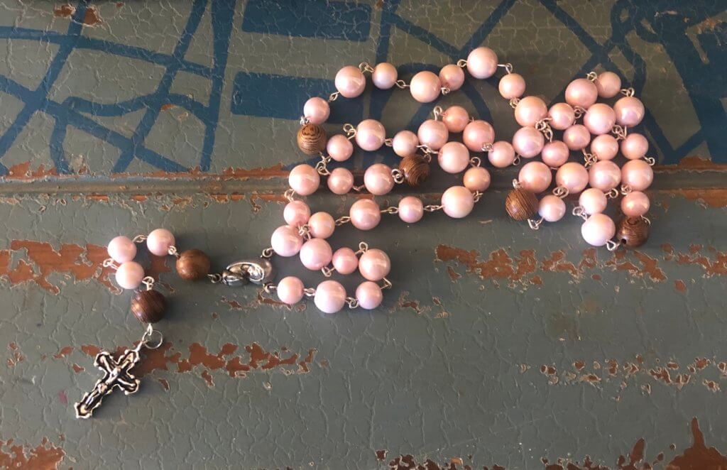 pink and wood beaded rosary